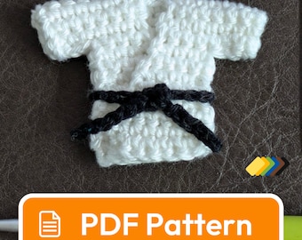 May include: White crocheted karate gi with a black belt. PDF Pattern.