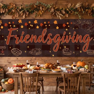 May include: A rectangular banner featuring the word Friendsgiving in large orange script against a dark brown buffalo plaid background, decorated with orange autumn leaves, stars, and line art illustrations of food and drink.