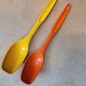 Vintage Foley Serving Spoons Yellow Orange Plastic Edge Wear Signs of Use