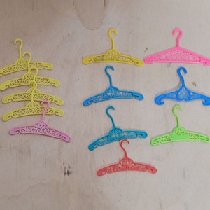 Vintage Barbie Francie Filigree Hanger Lot of 12 Multicolor Plastic