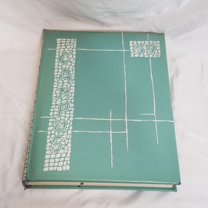 May include: A teal blue hardcover book with the word "CAMPUS" in white lettering on the front cover. The book has a white geometric design and the year "59" in a white box.