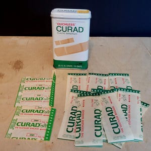Vintage Ouchless Curad Bandaids Metal Container Includes Wrapped Bandaids