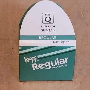 May include: A package of sheer toe, suntan colored pantyhose in size Q. The package is green and white with the text "Leggs Regular Pantyhose" and "14302 SQS 17".