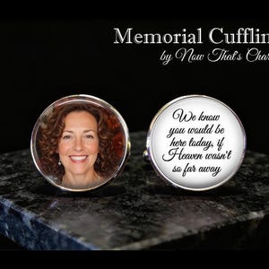 May include: Two round silver-toned cufflinks. One cufflink features a color photograph of a smiling person with curly brown hair. The other cufflink displays the black text: We know you would be here today, if Heaven wasn't so far away. Memorial Cufflinks.