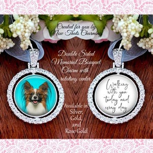 May include: A double-sided memorial bouquet charm with a rotating center, featuring a Papillon dog portrait on one side and the text 'Walking with you today and every day.' on the other. The circular pendant is framed by clear crystals.