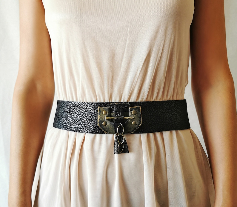 Handcrafted real leather waist belt in black with Steampunk Gothic Medieval buckle decor, perfect for  for a themed wedding, bride prop, photoshoot, or festival.