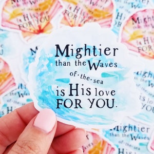 May include: A watercolor sticker with a blue and white wave design. The sticker features the text "Mightier than the Waves of the sea is His love FOR YOU."