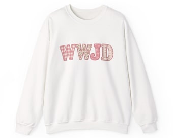 May include: A white long-sleeve crewneck sweatshirt featuring the letters WWJD printed across the chest. Each letter has a distinct pink and white pattern, including gingham, floral, and striped designs, with a thin pink outline around each letter.