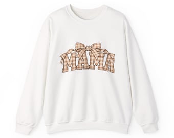 May include: A white long-sleeve crewneck sweatshirt featuring a central graphic print of the word MAMA in a tan and white gingham check pattern, topped with a matching gingham bow design centered above the letters on the front of the garment.