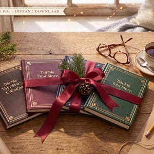 Four Tell Me Your Story memory journals tied with a red ribbon as a Christmas gift