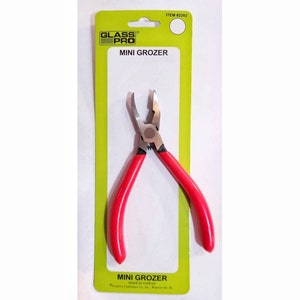 May include: Red mini grozer pliers with silver metal jaws, packaged on a green and white card with the text "GLASS PRO MINI GROZER" and "MADE IN TAIWAN".