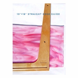 May include: A 10" x 18" wooden straight edge guide with a pink marbled surface underneath. The guide is labeled "Straight Edge Guide".