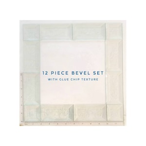 May include: A set of 12 clear glass tiles with beveled edges. The tiles are arranged in a square frame with a white background. The text "12 PIECE BEVEL SET WITH GLUE CHIP TEXTURE" is printed in blue on the white background.