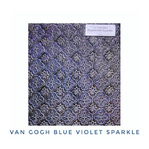 May include: Van Gogh Blue Violet Sparkle glass with a repeating floral pattern. The glass has a textured surface and a blue and violet color scheme. The text "Van Gogh Glass Blue/Violet Sparkle Flora" is visible.