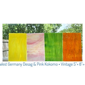 May include: Four rectangular stained glass pieces in yellow, pink, green, and orange. The text at the bottom reads "West Germany Desag & Pink Kokomo • Vintage 5" × 8" +-"