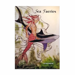 May include: A stained glass illustration of a mermaid riding a shark. The mermaid has long red hair and a pink tail. The shark is black and purple. The title "Sea Faeries" is at the top of the image and the artist's name "Jillian Sawyer" is at the bottom.