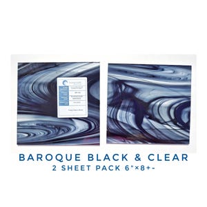 May include: Two sheets of black and clear baroque glass, each measuring 6 inches by 8 inches or larger. The glass has a swirling pattern of black and white.