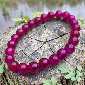Braccialetto di perline rosa fucsia, elastico, lunghezza 6 3/4 pollici.