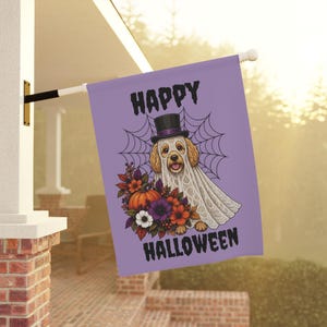 May include: A rectangular purple garden flag featuring a dog wearing a white lace ghost costume and a black top hat. Behind the dog is a spiderweb design. Below the dog is a cluster of autumn flowers and a pumpkin. Text reads HAPPY HALLOWEEN.