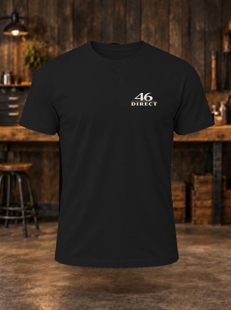 May include: A black short-sleeved t-shirt featuring the text 46 DIRECT printed in white on the upper left chest area. The shirt has a crew neckline and a standard fit, constructed from a solid black fabric with a clean and simple design.
