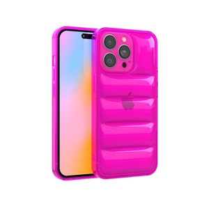 May include: A bright pink phone case with a quilted design. The case has a clear back and a raised camera bump.