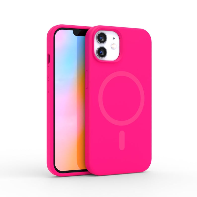 May include: A bright pink phone case with a matching phone. The case has a circular design on the back and a cutout for the camera. The phone screen is visible, showing a colorful display.