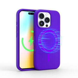 May include: A purple phone case with a built-in wireless charging pad. The case has a clear back panel and a white camera bump with three lenses. The charging pad is indicated by a blue and purple circle with lines radiating outward.