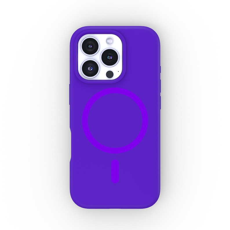 May include: A purple phone case with a built-in magnetic ring holder. The case has a white camera bump with three lenses.