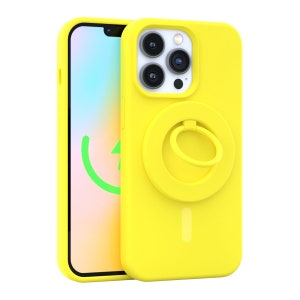 May include: A yellow phone case with a built-in ring holder. The case has a camera cutout and a cutout for the phone's charging port.