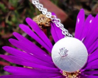 Single Starburst Circular Silver Necklace