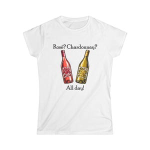 May include: A white short-sleeved t-shirt featuring a graphic of a pink wine bottle with a rose illustration and a yellow wine bottle with a grape illustration. The text above reads Rosé? Chardonnay? and the text below reads All day!