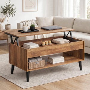May include: A rectangular wooden lift-top coffee table with a dark brown wood grain finish and four black tapered legs. The table features an open storage compartment beneath the top, a lower shelf, and a woven basket with folded textiles.