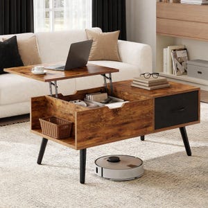 May include: A rectangular coffee table with a wood grain finish featuring a lift-top mechanism, a black drawer, an open storage compartment with a small woven basket, and four black tapered legs. A laptop sits on the raised surface.