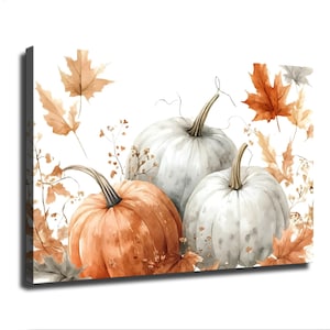 May include: A rectangular canvas print featuring a watercolour illustration of three pumpkins, one orange and two white, surrounded by scattered autumn maple leaves and thin, delicate dried branches against a plain white background.