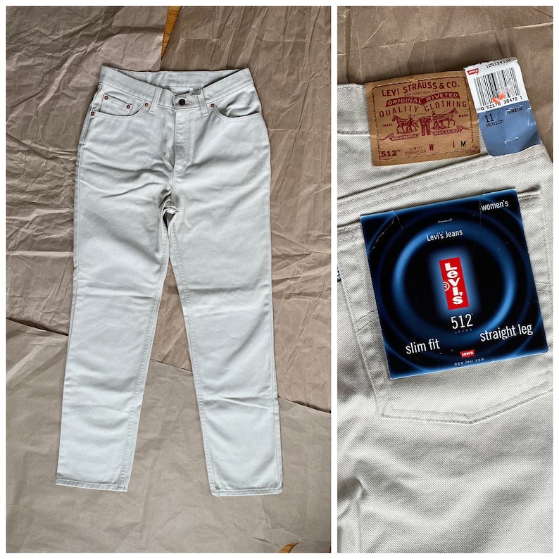 May include: A pair of light-wash denim jeans with a slim fit and straight leg. The jeans have a Levi's label with the text "Levi's Jeans", "512", "slim fit", and "straight leg".
