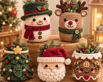 May include: Five crocheted holiday containers featuring a snowman with a green hat, a reindeer with antlers, a decorated Christmas tree, a Santa Claus with a red hat, and a gingerbread house, all filled with artificial pine and red berries.