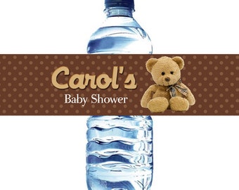 May include: Brown and white polka dot water bottle label with the text "Carol's Baby Shower" and a brown teddy bear wearing a plaid bow.