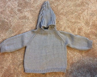 Hand knitted hooded baby zip down the back sweater