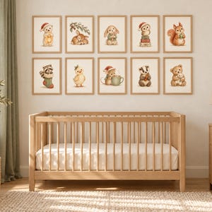 May include: A set of ten framed wall art prints featuring watercolor illustrations of woodland animals in holiday attire, including a bear, deer, rabbit, owl, squirrel, raccoon, chick, mouse, badger, and teddy bear, arranged in two rows.