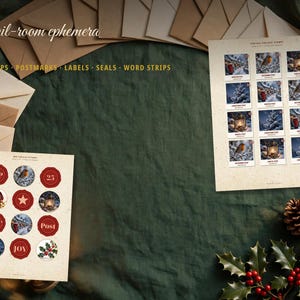 May include: A collection of mail-room ephemera featuring two sheets of paper with printed postage stamps and circular seals, surrounded by several tan envelopes, pinecones, and holly sprigs on a dark green fabric background.