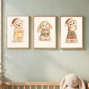 May include: Three framed wall art prints featuring a white polar bear wearing a red Santa hat and holding a lantern, a rabbit in a green sweater holding a candy cane, and an owl in a red Santa hat perched on a stack of three gift boxes.