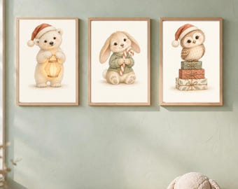 May include: Three framed wall art prints featuring a white polar bear wearing a red Santa hat and holding a lantern, a rabbit in a green sweater holding a candy cane, and an owl in a red Santa hat perched on a stack of three gift boxes.