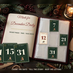 May include: A scrapbook album with clear pocket pages containing numbered cards. The title page reads Made for December Daily POCKET PAGES TAGS TUCK SPOTS. Cards feature the numbers 1, 7, 12, 15, 21, and 31 in dark green and cream.