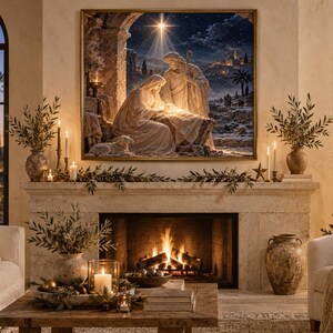 May include: A framed wall art print depicting a nativity scene with a glowing star above a stable, hung over a stone fireplace mantel. The mantel features greenery, candles, and vases, with a lit fire burning in the hearth below.