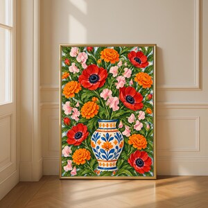 May include: A framed vertical wall art print featuring a vibrant bouquet of red poppies, orange marigolds, and pale pink sweet peas arranged in a white ceramic vase with blue and orange floral patterns, set against a lush green foliage background.