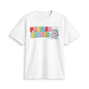 May include: A white short-sleeved t-shirt featuring the text "PROBLEM SOLVER" in colourful, bubble-style letters. Next to the text is a cartoon calculator character with a smiling face, arms, and legs, surrounded by small colourful star icons.