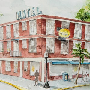 May include: Watercolor painting of a red brick hotel on a corner lot. The hotel has multiple windows and a sign that reads "HOTEL" on the roof. A sign that reads "HOTEL MARIA" hangs from the corner. A palm tree and street lamp are in front.