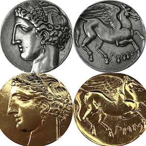 May include: Two sets of ancient Greek coins, one set in silver and one set in gold. The coins feature a profile of a woman on one side and a winged horse on the other.
