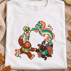 Cryptid Nurse Shirt, Bigfoot Mothman Alien Dancing Tee, Comfort Colors Vintage Nursing Gift, Weirdcore RN Nurse Week Halloween T-Shirt