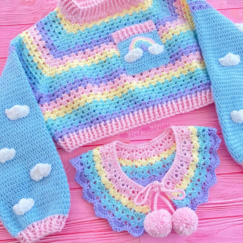 May include: A rainbow striped crochet top with a rainbow and cloud pocket and matching rainbow striped crochet collar with pom poms.